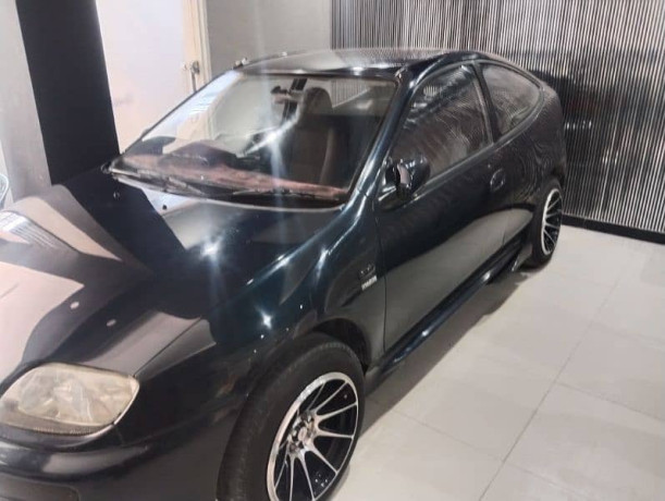mazda-323-1995-big-1