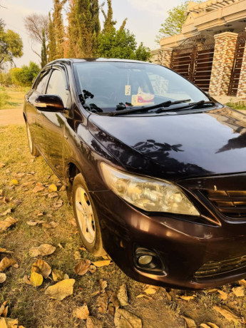 toyota-corolla-gli-2013-model-red-wine-karachi-registered-big-3