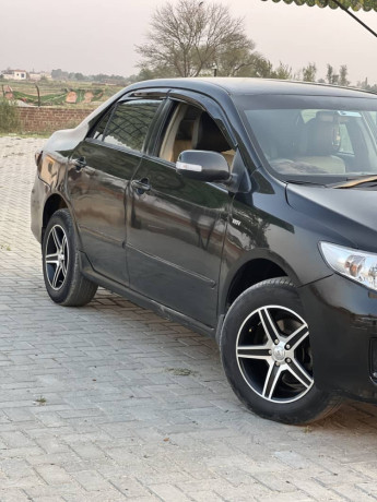 corolla-xli-converted-to-gli-facelifted-tk-2014-model-big-1