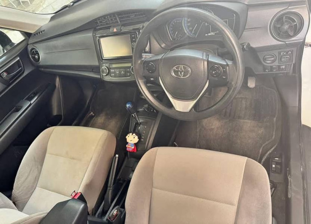 toyota-corolla-axio-hybrid-pearl-white-big-4